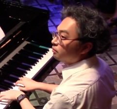 Thomas Cheng, founder of Pro Music Jazz Studio, playing jazz piano.